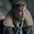 masters-of-the-air-austin-butler-brown-and-black-shearling-leather-jacket