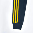 navy-blue-tracksuit-yellow-stripes